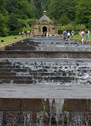 The step waterfall attracts tourists and waders.
