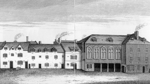 "It was an oblong pile of barrack building, partitioned into squalid houses standing back to back, so that there were no back rooms; environed by a narrow paved yard, hemmed in by high walls duly spiked at top."