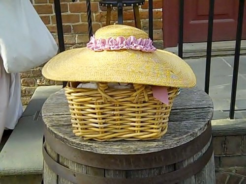 Outside the milliner's shop