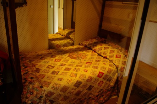 The bed with the diamond  pane quilt that Jane helped to sew. Chawton Cottage Image@Tony Grant