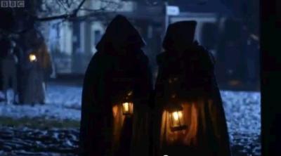 Walking to the ball carrying lanterns. 