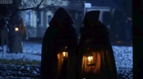 Walking to the ball carrying lanterns. 