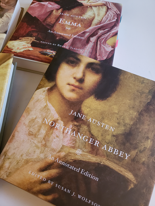 Image of the covers of Northanger Abbey (front) and Emma (back) by Jane Austen and published by Harvard University Press.