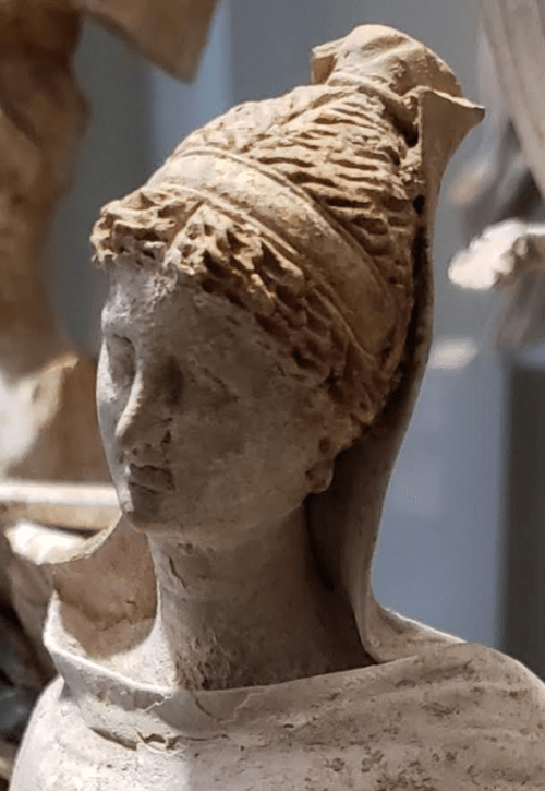 Standing Maiden. Greek (Tarentum, Italy) 3rd century B.C.. Terracotta with traces of paint and gilding.