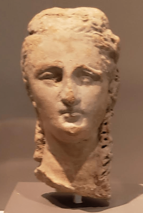 Terracotta Head of a Woman with Long Curls. Greek (South Italy), 3rd century B.C.