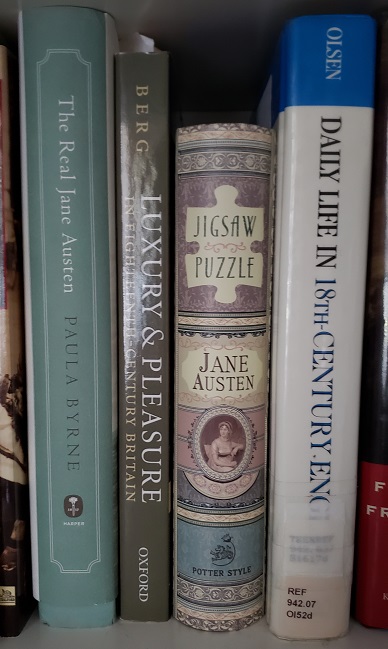 Spine of Jane Austen book-style jigsaw puzzle on book shelf