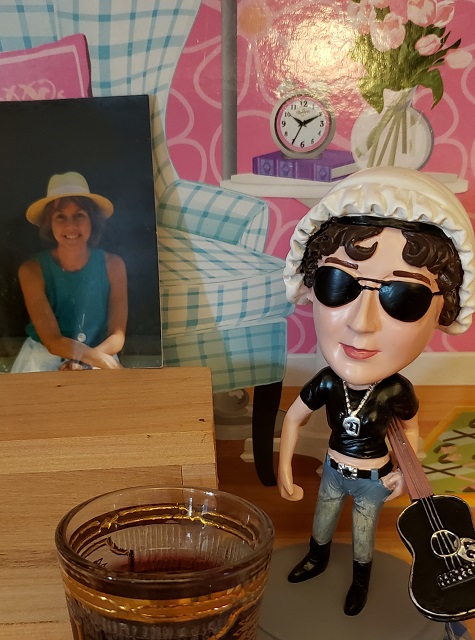 Jane drinking a glass of wine