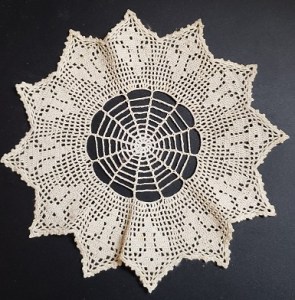 Image of a small hand-made doily.