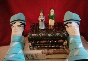 Denise and her socks view her Darcy and Lizzie figurines.