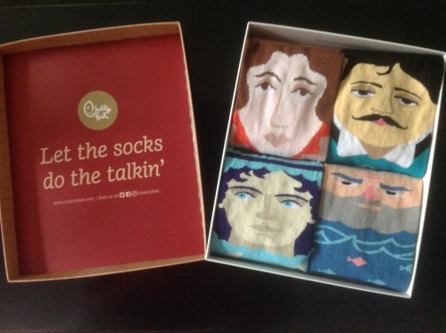 Image of The socks inside the box, with the byline of Let the socks do the talkin'