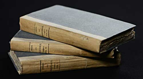 Image of a three-volume first edition of Pride and Prejudice bound in a simple publishers board. National Library of Scotland