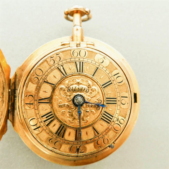 Gold pocket watch opened, with cover and numerals inside